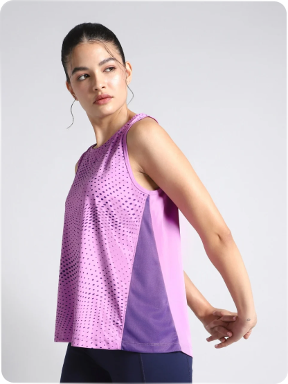 Model wearing a purple sleeveless workout top